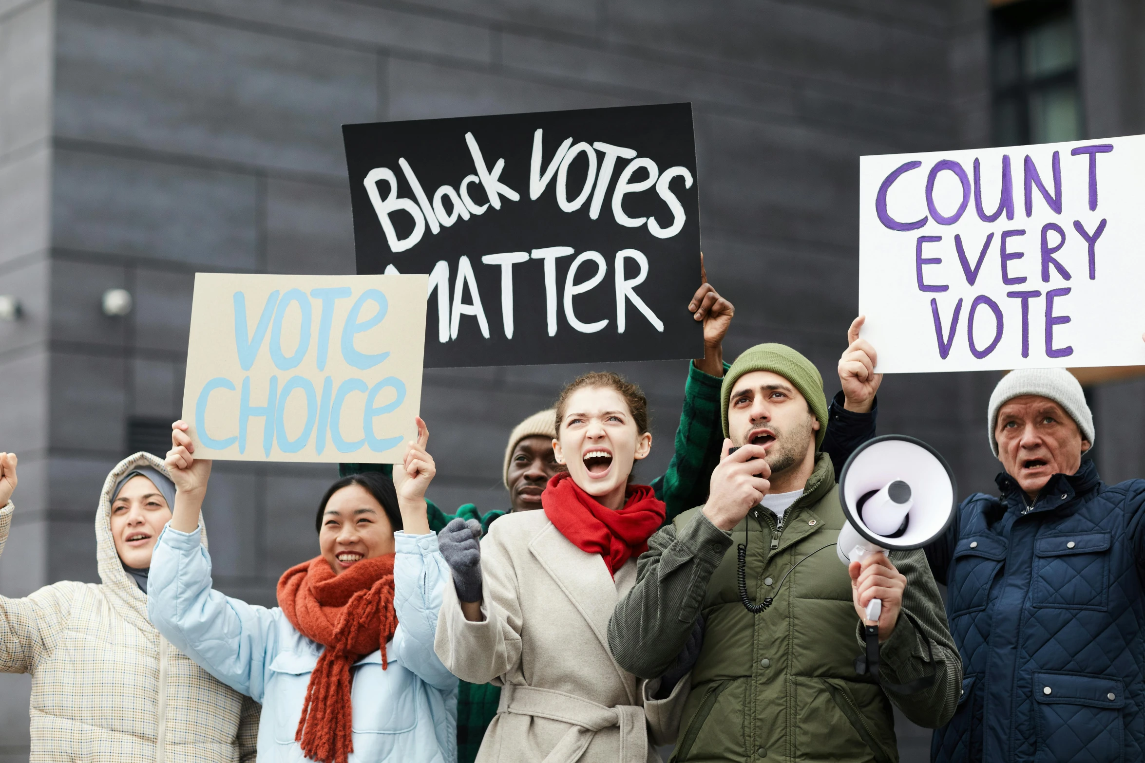 a group of people holding signs in the air, a photo, shutterstock, sots art, mostly black, court politics, a cozy, background image