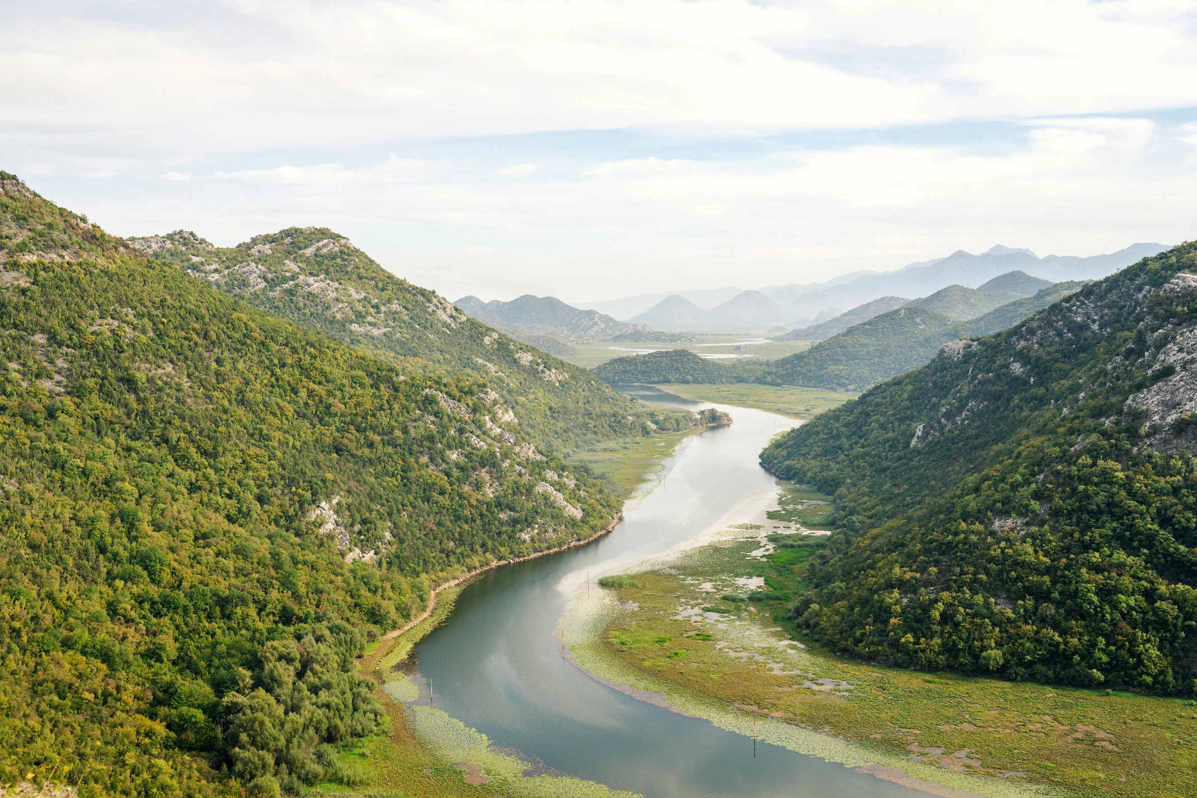 a river running through a lush green valley, inspired by Slava Raškaj, pexels contest winner, hurufiyya, croatian coastline, lakeside mountains, dezeen, panels