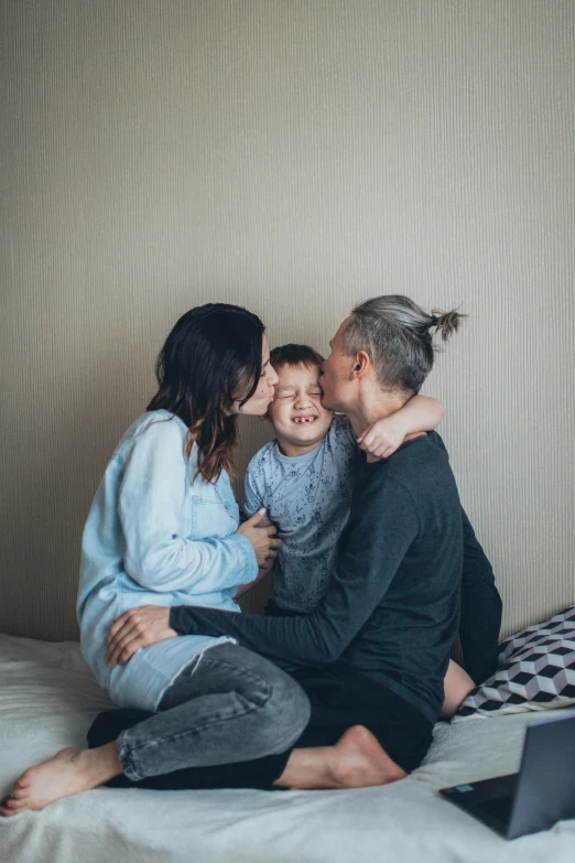 a woman and two children sitting on a bed, by Adam Marczyński, pexels contest winner, incoherents, lesbian kiss, grey backdrop, 4 0 years old man, 256435456k film