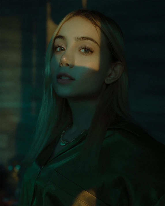 a woman with long hair standing in a dark room, inspired by Elsa Bleda, iu lee ji-eun as a super villain, teal color graded, portrait of ariana grande, sydney sweeney