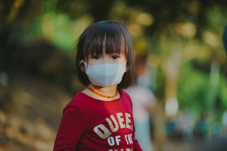 a little girl with a face mask on, pexels contest winner, avatar image, haze over the shoulder shot, asian, from waist up