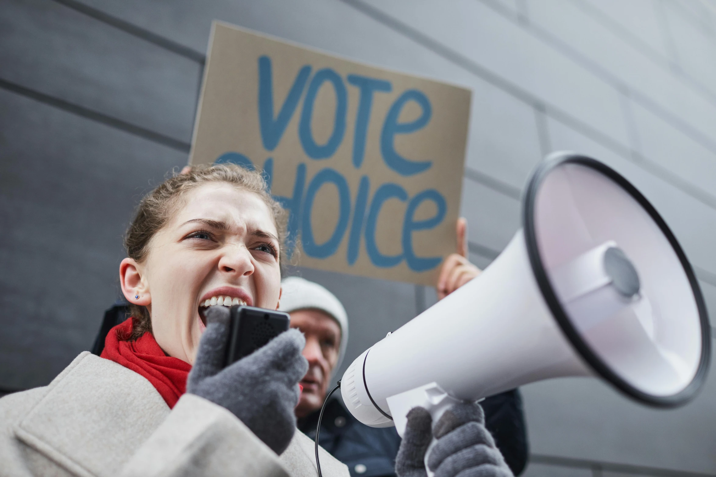 a woman holding a megaphone and a sign, shutterstock, antipodeans, heavily upvoted, but who's to judge, h3h3, parliament