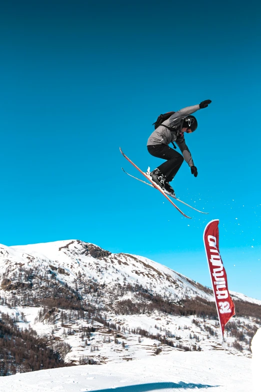 a man flying through the air while riding skis, by Carlo Martini, pexels contest winner, figuration libre, square, panels, festivals, high quality photo