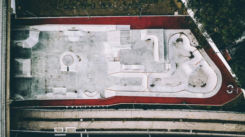 an aerial view of a skateboard park, a mosaic, unsplash contest winner, graffiti, oscar niemeyer, thumbnail, unfinished, 1980s photo