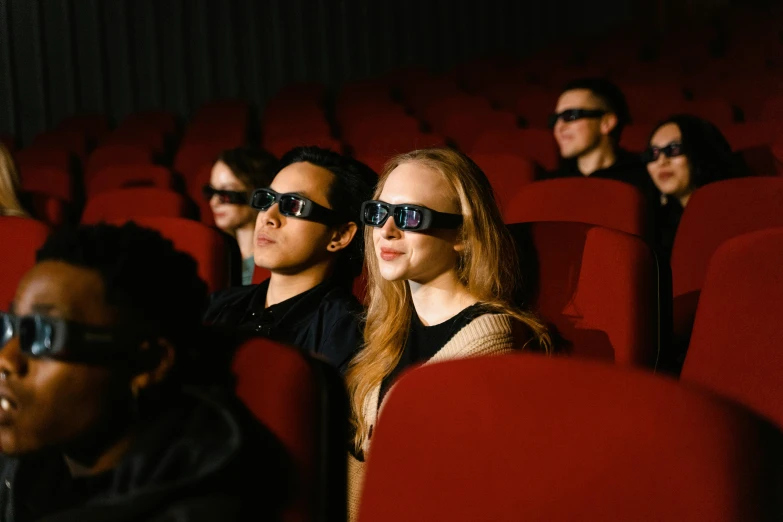 a group of people sitting in a theater wearing 3d glasses, a hologram, by Matthias Stom, pexels, hyperrealism, movie scene, avatar image, high definition movie, instagram post