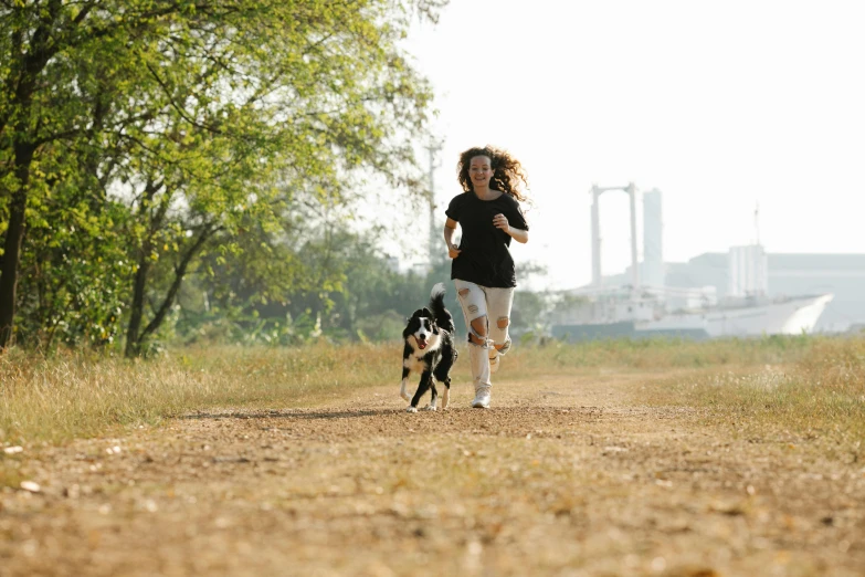 a woman running with a dog on a dirt road, avatar image, 15081959 21121991 01012000 4k, city park, black
