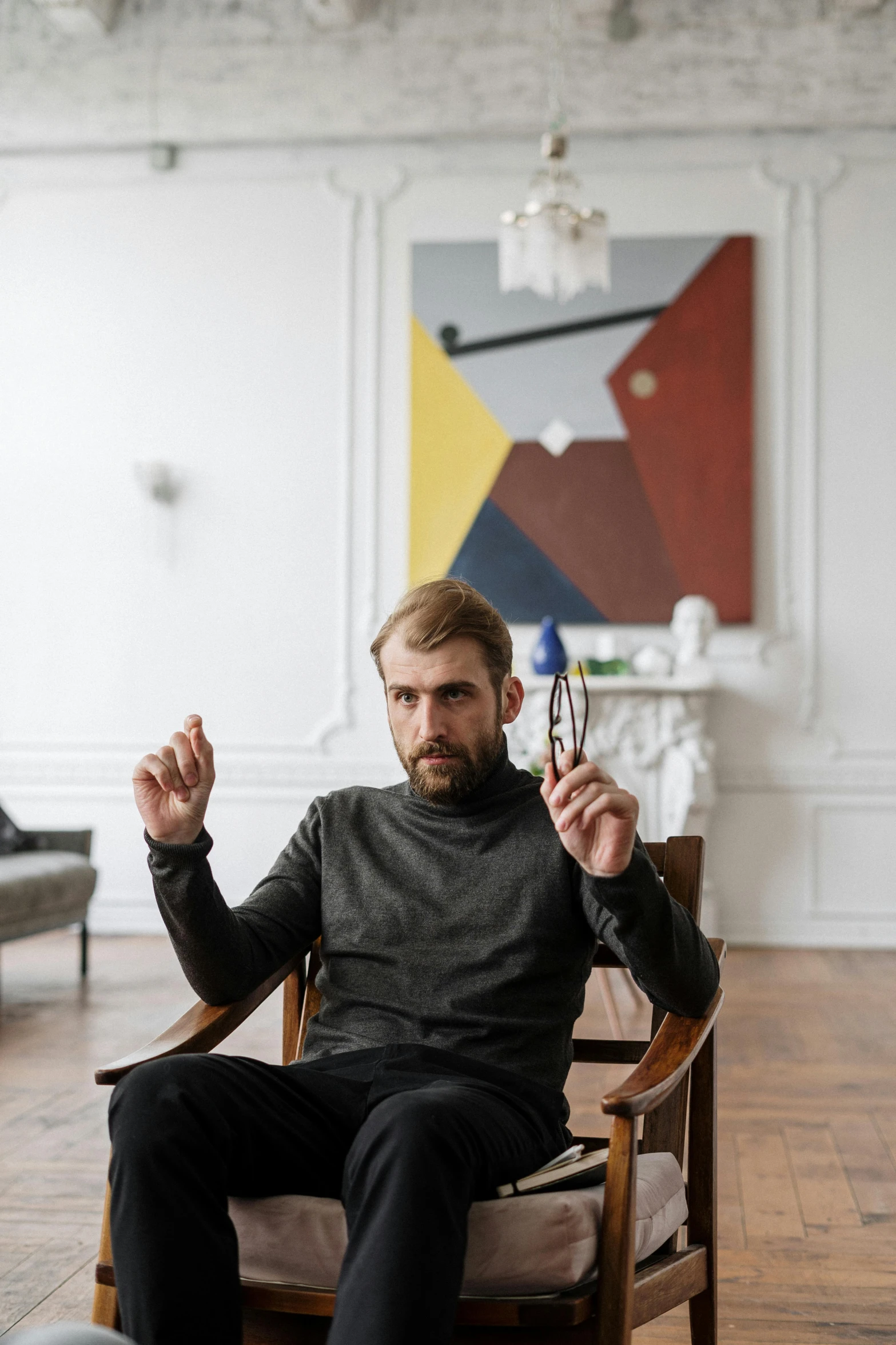 a man sitting in a chair with a glass in his hand, a minimalist painting, inspired by Thomas Mann Baynes, pexels contest winner, looking confused, ignant, portrait of homelander, ryan church