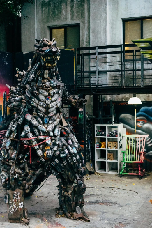 a man that is standing in the street, a statue, by Adam Marczyński, kinetic art, godzilla vs mechagodzilla, inside a grand messy studio, upcycled, medium shot of two characters