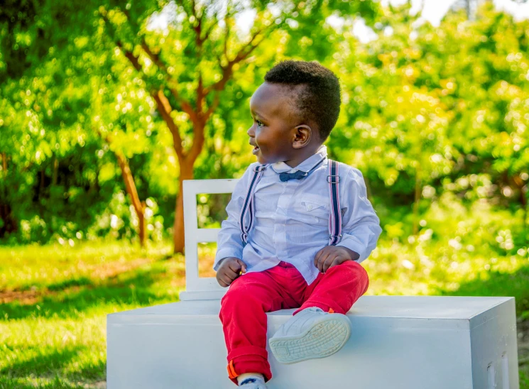 a young boy sitting on top of a white bench, pexels contest winner, emmanuel shiru, 2 years old, attractive and good looking, 15081959 21121991 01012000 4k