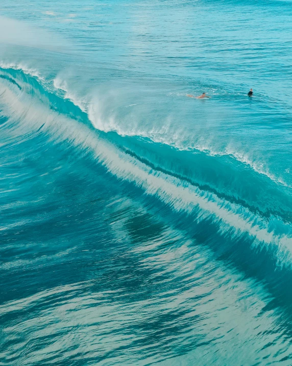 a man riding a wave on top of a surfboard, pexels contest winner, renaissance, blue and cyan colors, wall of water either side, waikiki beach, a high angle shot