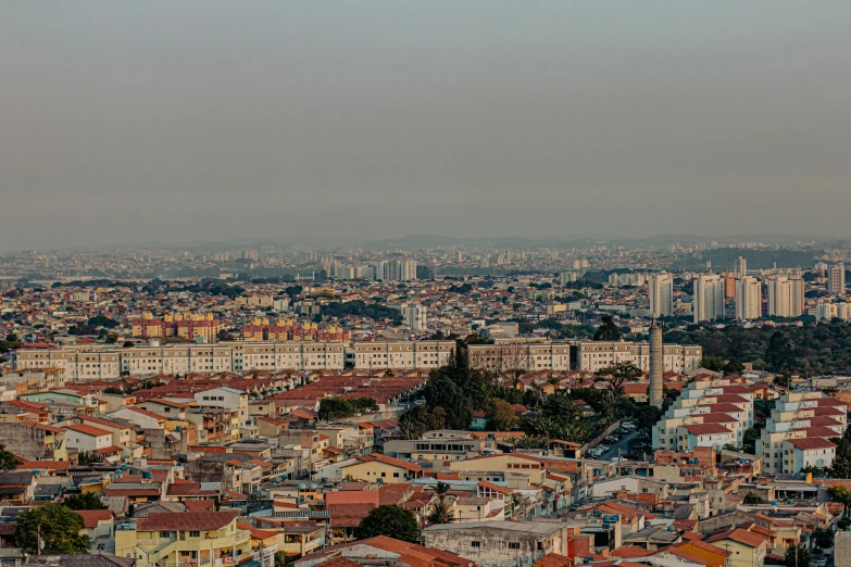 a view of a city from the top of a building, by Joze Ciuha, pexels contest winner, hyperrealism, air pollution, gui guimaraes, panoramic, slide show