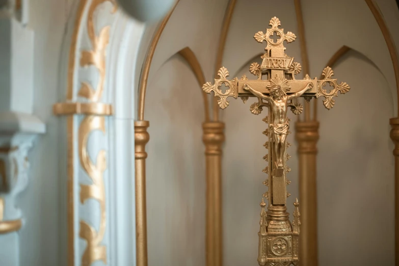 a close up of a cross in a church, a portrait, unsplash, baroque, ornate gold, cast, inside a grand, former