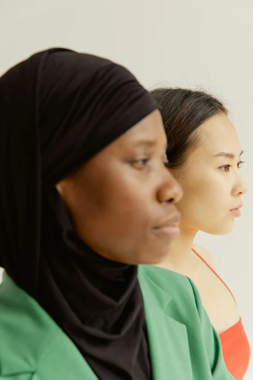 a group of women standing next to each other, trending on unsplash, hyperrealism, side profile portrait, wearing green clothing, ethnicity : japanese, portrait of two people
