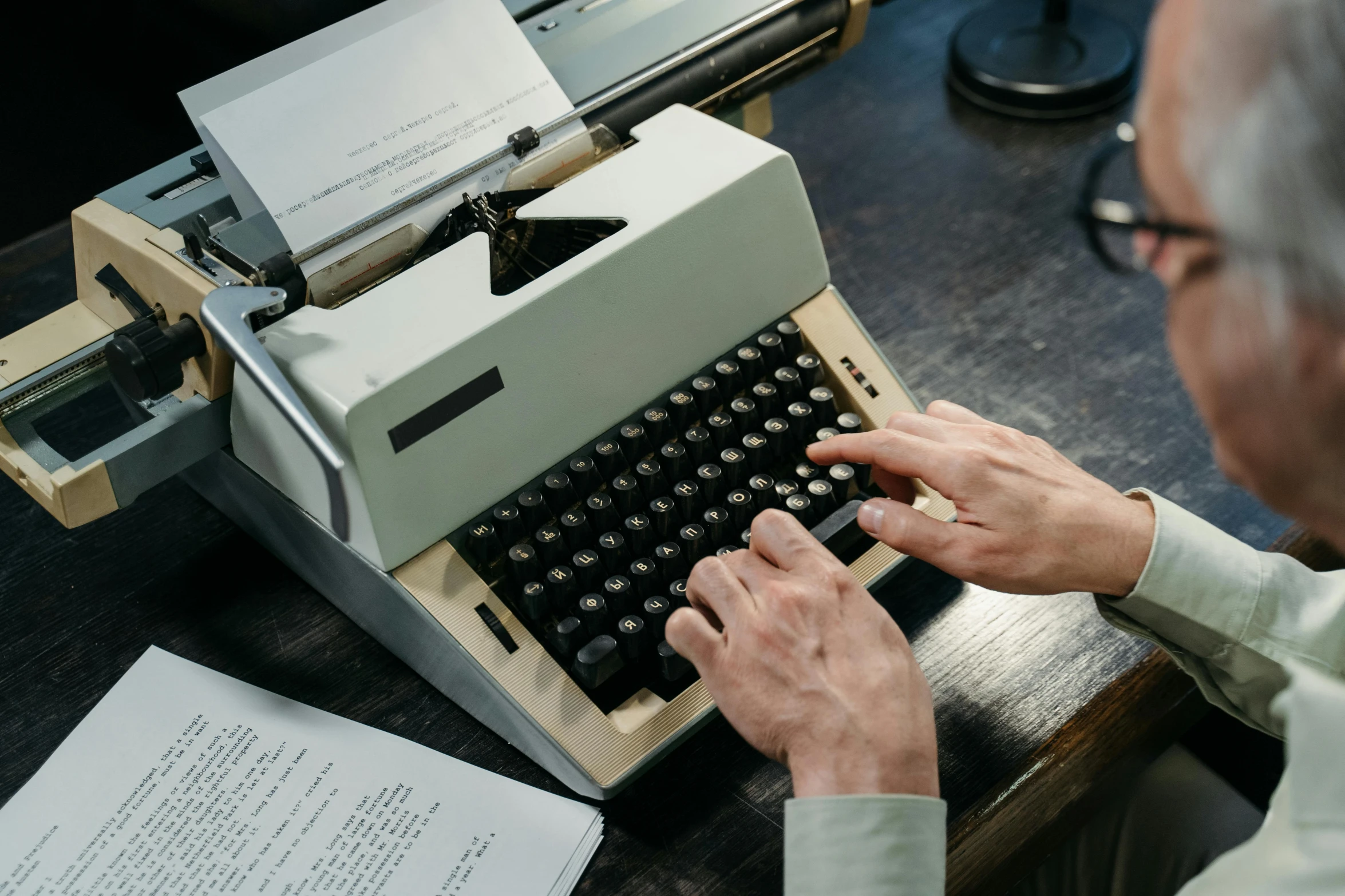 a man typing on an old fashioned typewriter, pexels contest winner, private press, commodore 6 4, thumbnail, on a desk, hollywood standard