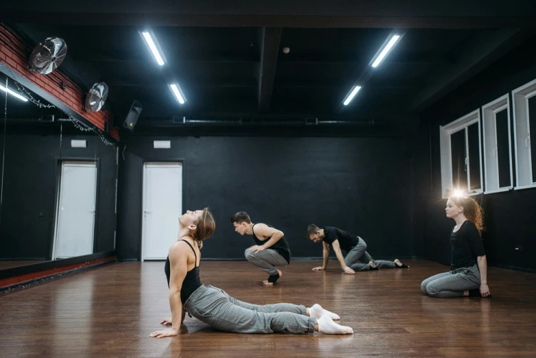 a group of people in a dance studio, unsplash, profile image, bending down slightly, azamat khairov, ilustration