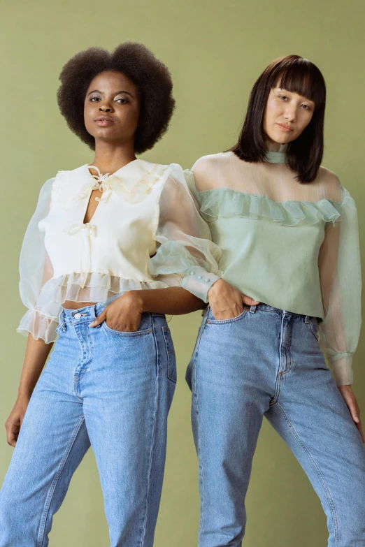 a couple of women standing next to each other, by Winona Nelson, kawaii shirt and jeans, sheer fabrics, top down shot, pastel green