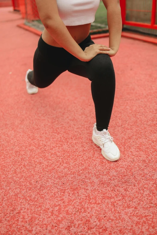 a woman in a white tank top and black leggings, pexels contest winner, red carpeted floor, sports setting, 15081959 21121991 01012000 4k, wearing white tights