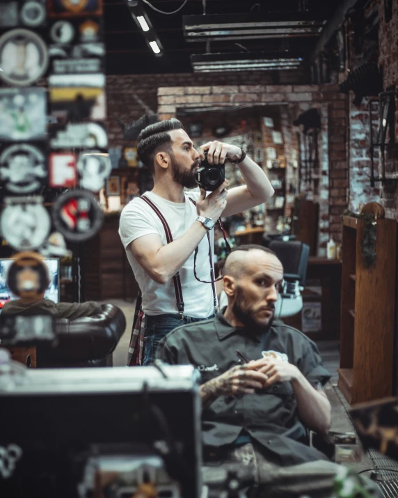 a man getting a haircut in a barber shop, by Niko Henrichon, trending on pexels, lgbt, sitting at a bar, thumbnail, old color photo