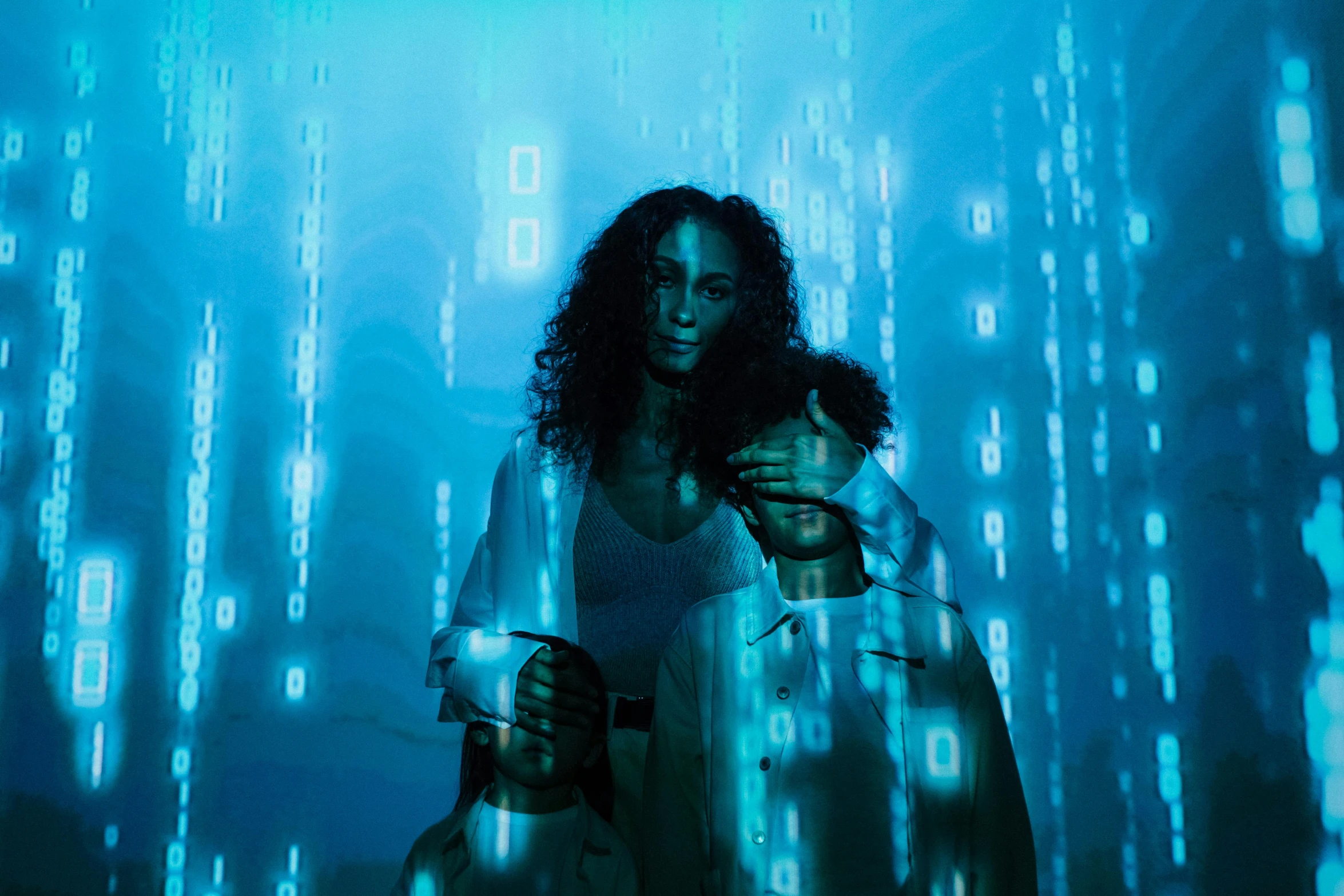 a man and a woman standing next to each other, a hologram, pexels contest winner, cybernetic dreadlocks, computer code, photo of a black woman, woman holding another woman