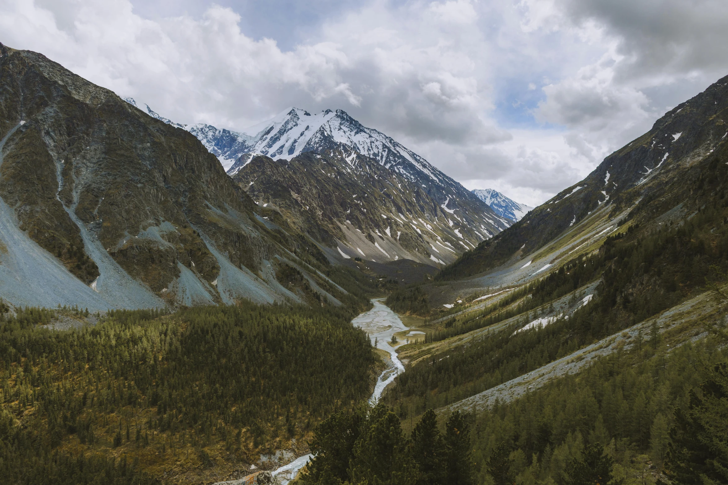 a river running through a lush green valley, an album cover, by Matthias Weischer, unsplash contest winner, kazakh, majestic snowy mountains, 000 — википедия, brown