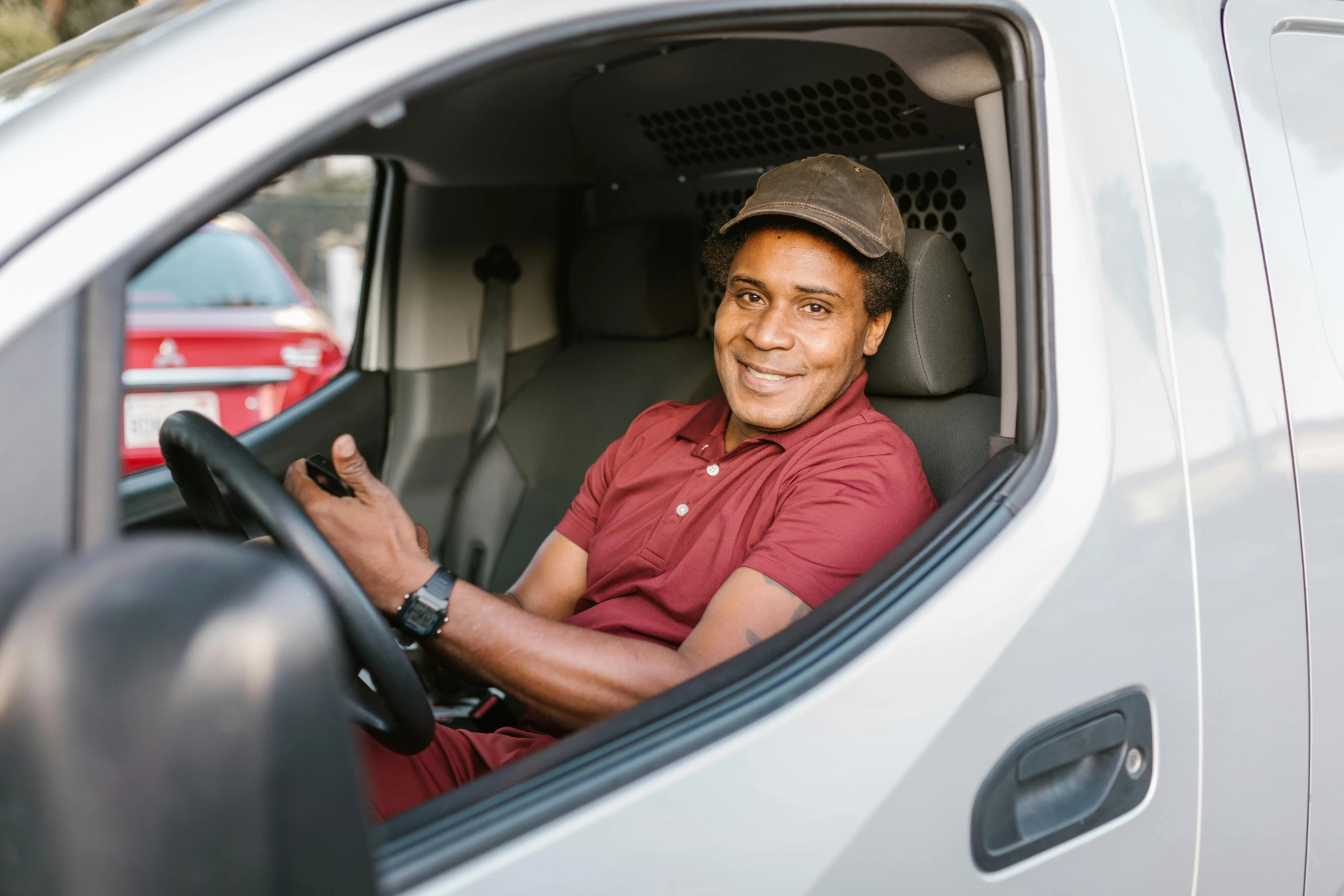 a man sitting in the drivers seat of a truck, a portrait, pexels contest winner, smiling male, avatar image, customers, as well as the handyboy