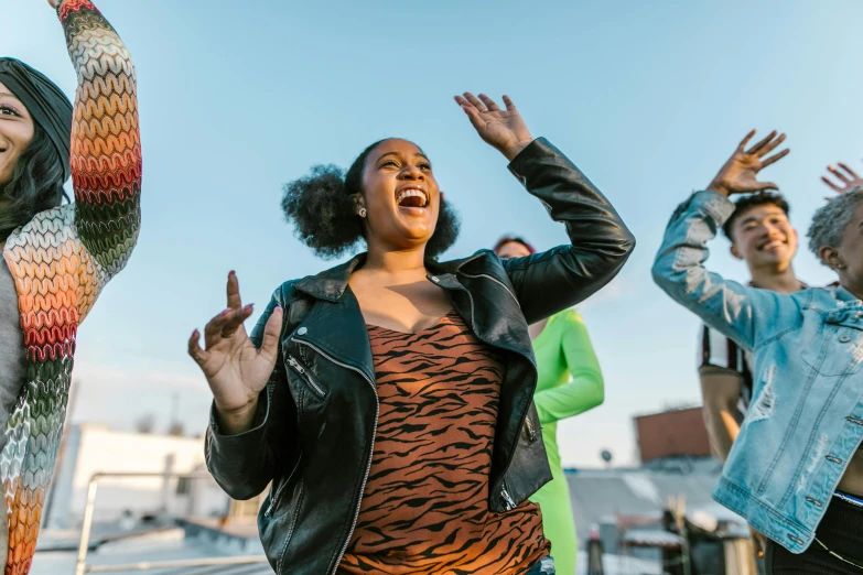 a group of people standing on top of a roof, an album cover, trending on pexels, happening, fat latin woman dancing, afropunk, 15081959 21121991 01012000 4k, performing a music video