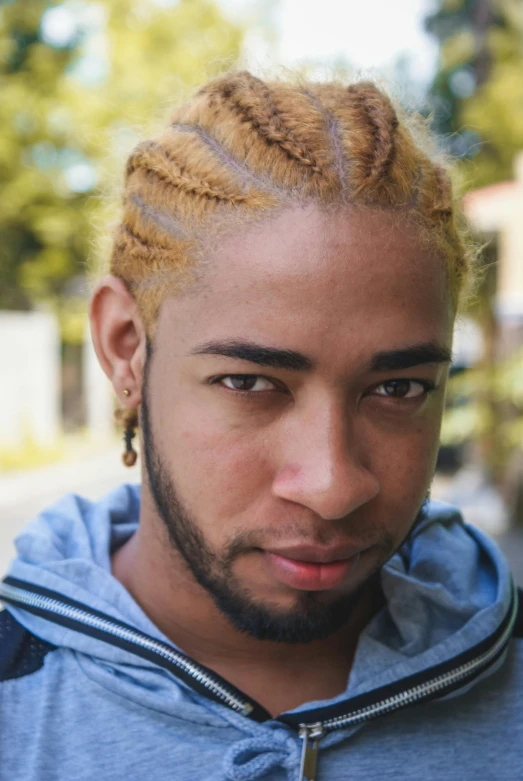 a close up of a person wearing a hoodie, cornrows, light yellow hair, very handsome, wild ginger hair
