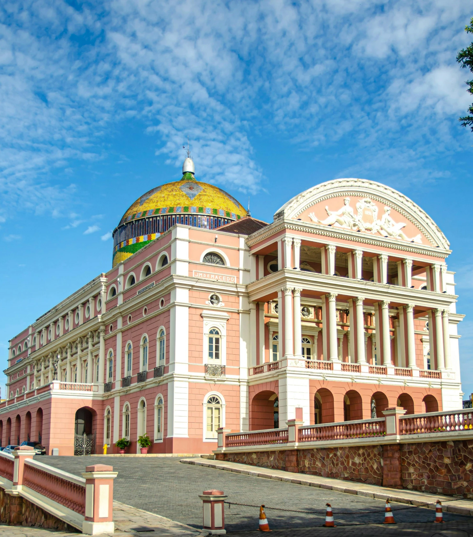 a large building with a yellow dome on top of it, brazilian, pink and gold, war theatre, moorish architecture