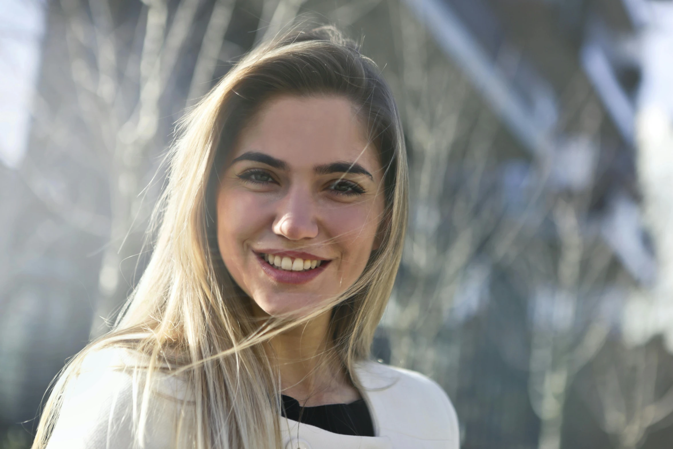 a woman with long blonde hair smiling at the camera, by Niko Henrichon, pexels contest winner, maia sandu hyperrealistic, engineer, slightly sunny, meni chatzipanagiotou