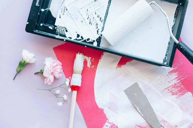 a couple of paint brushes sitting on top of a piece of paper, a minimalist painting, by Julia Pishtar, pexels contest winner, action painting, white and pink, red and white marble panels, flowers around, painting on the ceiling