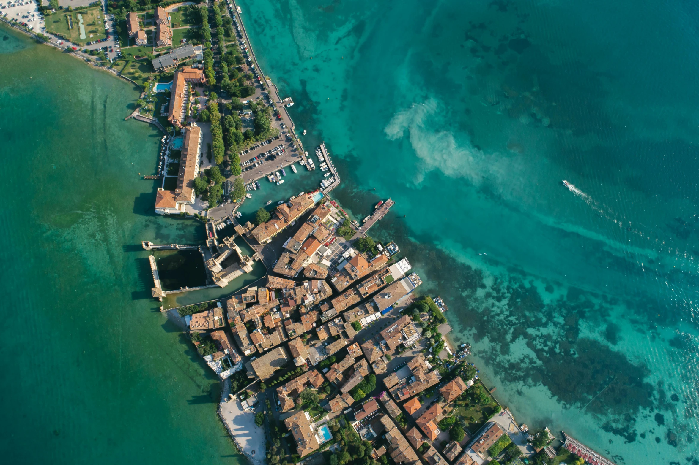 an aerial view of a small town next to the ocean, by Patrick Pietropoli, pexels contest winner, renaissance, venice biennale's golden lion, turquoise water, thumbnail, partly underwater