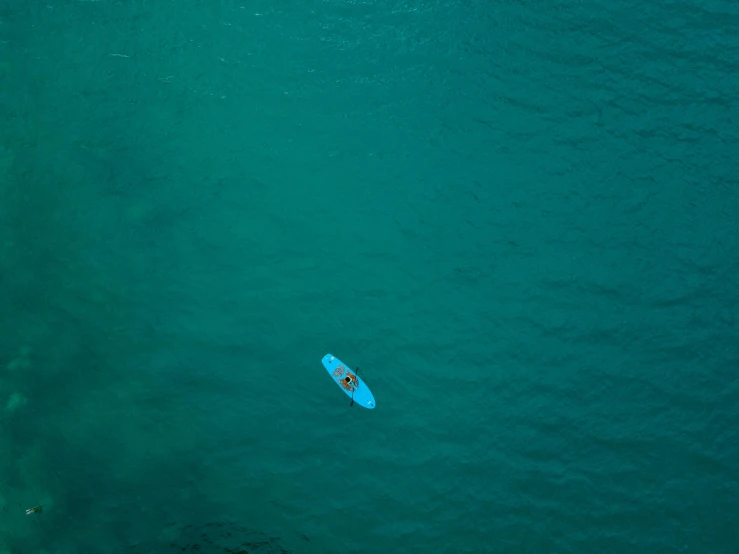 a person riding a surfboard on top of a body of water, by Matthias Weischer, pexels contest winner, minimalism, turquoise blue face, canoe, aerial, gif