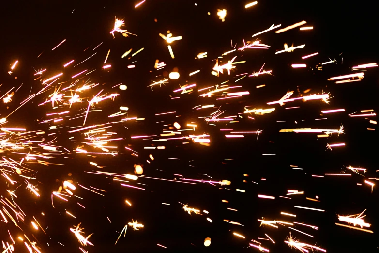 a close up of a firework on a black background, a stipple, pexels, auto-destructive art, 8k vfx render, welding torches for arms, thumbnail, glittering stars scattered about