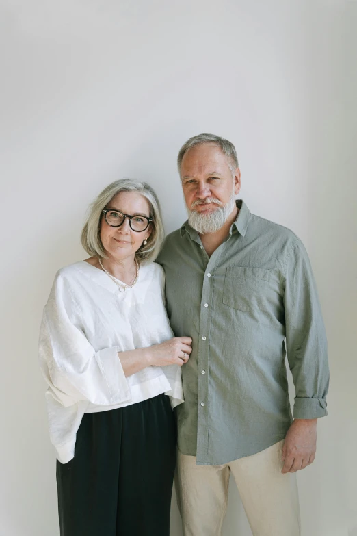 a man and a woman standing next to each other, a portrait, unsplash, dan harmon, scandinavian design, grayish, aged