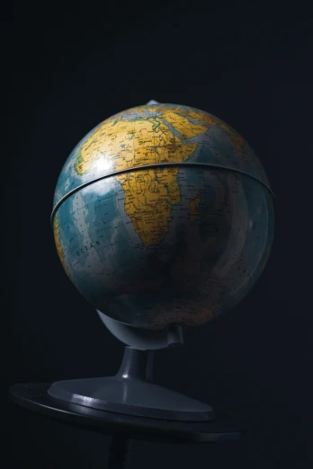an old globe on a stand against a black background, by Greg Rutkowski, modernism, satellite imagery, instagram post, pbr material, 15081959 21121991 01012000 4k