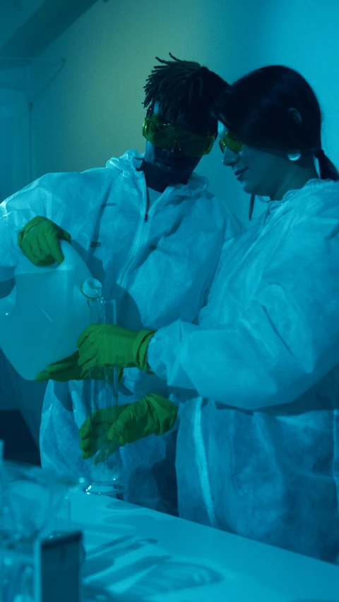 a couple of people that are in a lab, a photo, flickr, staff wearing hazmat suits, dry ice, medium closeup, promo image