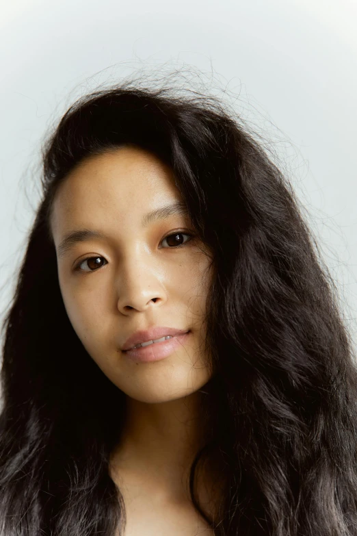 a close up of a person with long hair, inspired by Fei Danxu, pronounced cheekbones, no makeup wavy hair, jaya su berg, shaved face