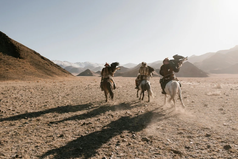 a group of men riding on the backs of horses, by Peter Churcher, unsplash contest winner, hurufiyya, movie action still frame, liang mark, lachlan bailey, tengri