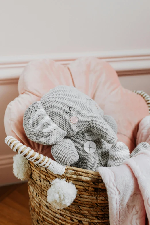 a stuffed elephant sitting in a wicker basket, blush, lily, seraphine, smooth tiny details