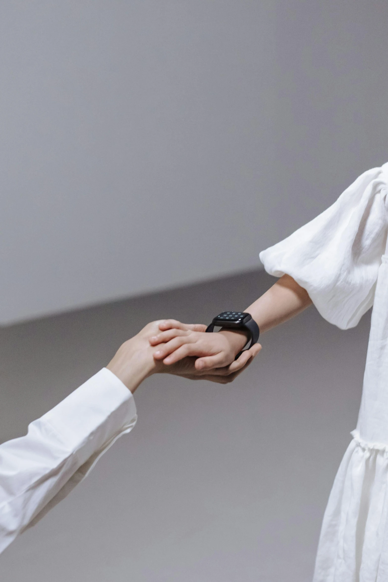 a woman in a white dress shaking hands with a man in a white shirt, inspired by Fei Danxu, showstudio, wearing a watch, integrated synthetic android, creterion collection