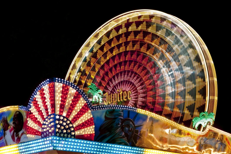 a carnival ride at night with a ferris in the background, a photo, by Thomas Häfner, kinetic art, avatar image, colorful signs, half image