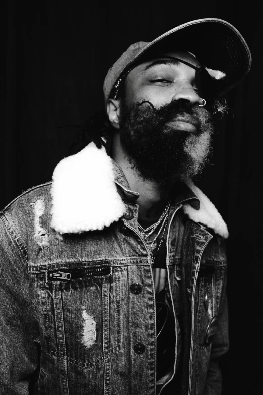 a black and white photo of a man with a beard, an album cover, inspired by Ras Akyem, trending on pexels, rapper bling jewelry, kai carpenter, kaws, (night)