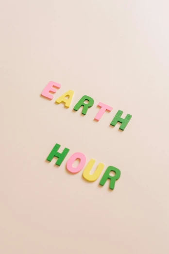 the word earth hour spelled in wooden letters, trending on unsplash, green and pink, lunar time, ello, y2k aesthetic