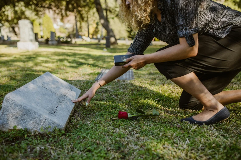a woman placing a rose on a grave, by Meredith Dillman, pexels, avatar image, modern technology, carson ellis, flattened