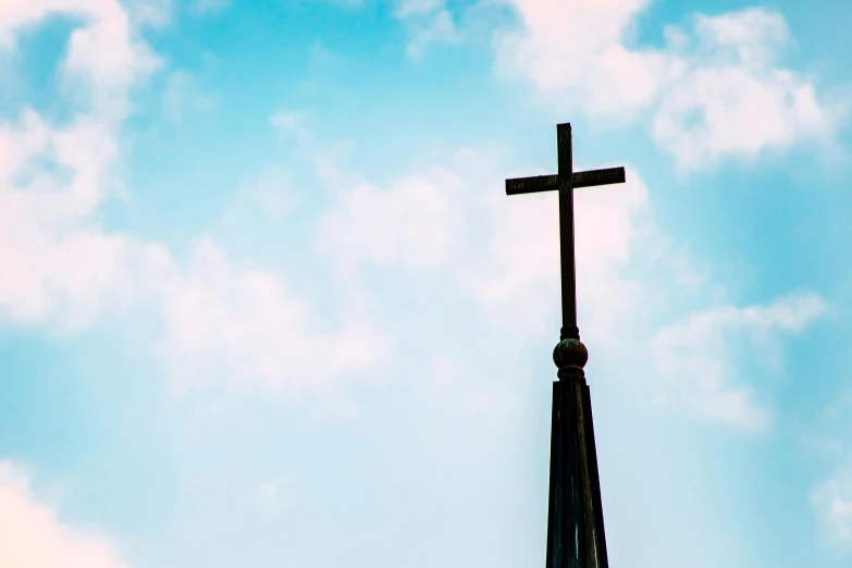 a cross on top of a steeple against a blue sky, by Carey Morris, unsplash, unilalianism, instagram post, profile image
