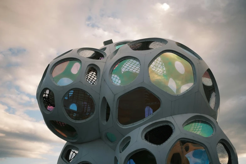 a group of people standing in front of a building, inspired by Buckminster Fuller, unsplash contest winner, interactive art, trypophobia, reykjavik, detail structure, holy dice in the clouds