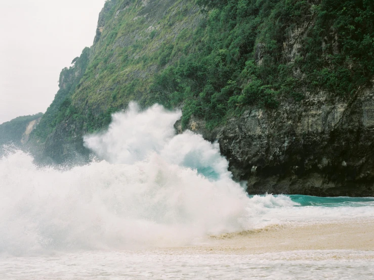 a man riding a wave on top of a sandy beach, pexels contest winner, visual art, sea storm and big waves cliffs, in style of ren hang, masanori warugai, rushing water