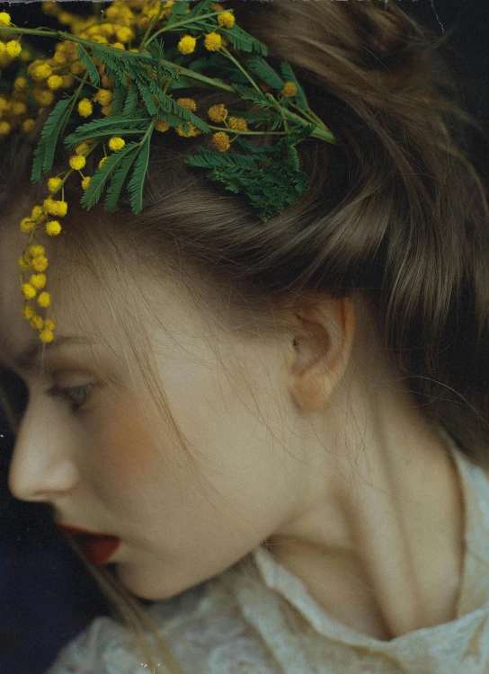 a woman with a yellow flower in her hair, inspired by Oleg Oprisco, trending on pexels, made of flowers and berries, greens), uncropped, hair styled in a bun