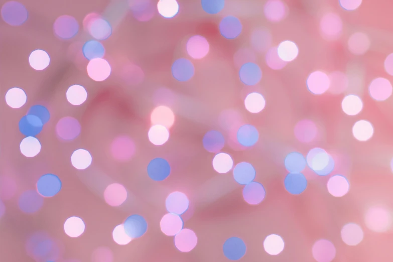 a blurry photo of pink and blue lights, by Rachel Reckitt, unsplash, pointillism, light pink background, holiday season, pink pastel, ((pink))