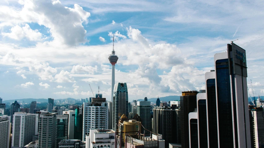 a view of a city from the top of a building, pexels contest winner, hurufiyya, malaysian, tall buildings in background, 2045, fan favorite